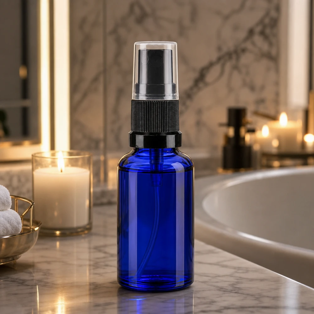Blauwe glazen flessen 20ml met zwart pompverstuiver Blauwe spuitfles van 20 ml, smal van vorm, met zwarte schroefverstuiver, apotheekkwaliteit