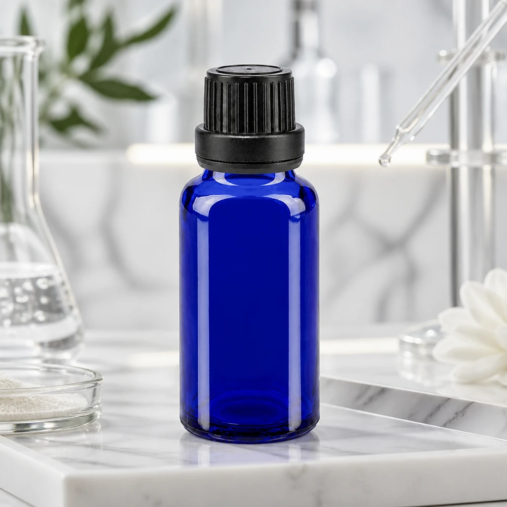Blauwe glazen flessen 20ml met zwart druppelsluiting 2mm VR Flesje van 20 ml van blauw apothekersglas met een zwarte schroefdop en een druppelaar
