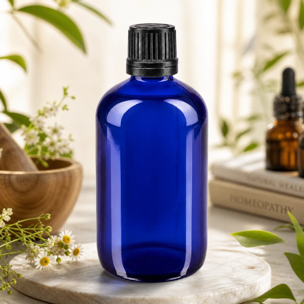 Cilindrische blauwe glazen fles van 100 ml met zwarte originele dop voor aromatherapie