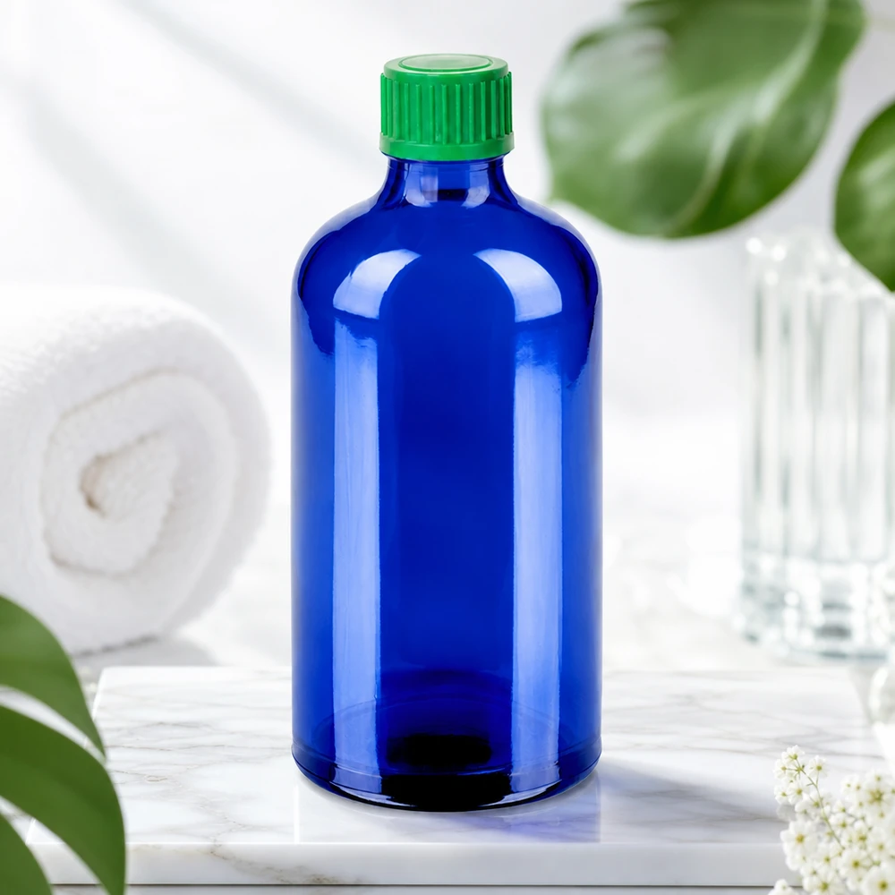 Hoogwaardige BlueLine druppelfles 100ml van donkerblauw glas met groene schroefdop voor UV-bescherming