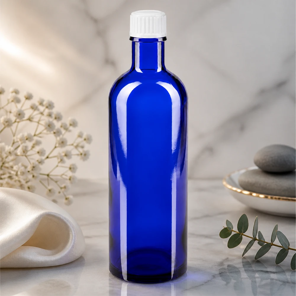 Blauwe glazen flessen 200ml met wit schroefsluiting St Hoogwaardige blauwe glazen fles van 200 ml met een geribbelde witte dop voor natuurgeneeskunde