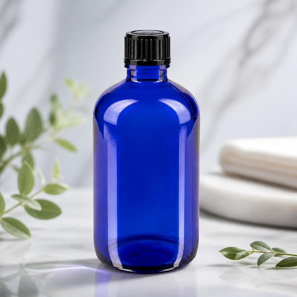 Slanke kobaltblauwe glazen fles van 100 ml met druppelaar voor serums, tincturen en etherische oliën
