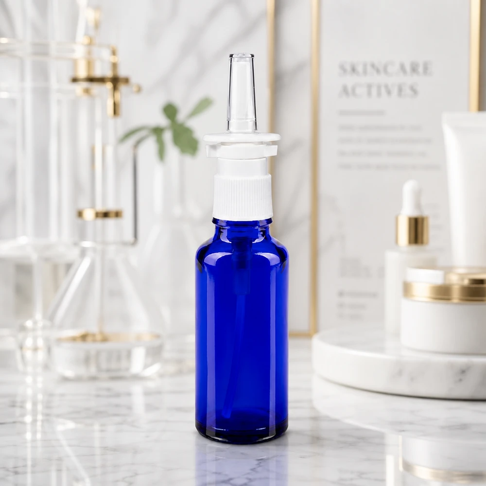Blauwe spuitfles van 30 ml voor neusspray, gemaakt van apothekersglas, met STD-pompdop