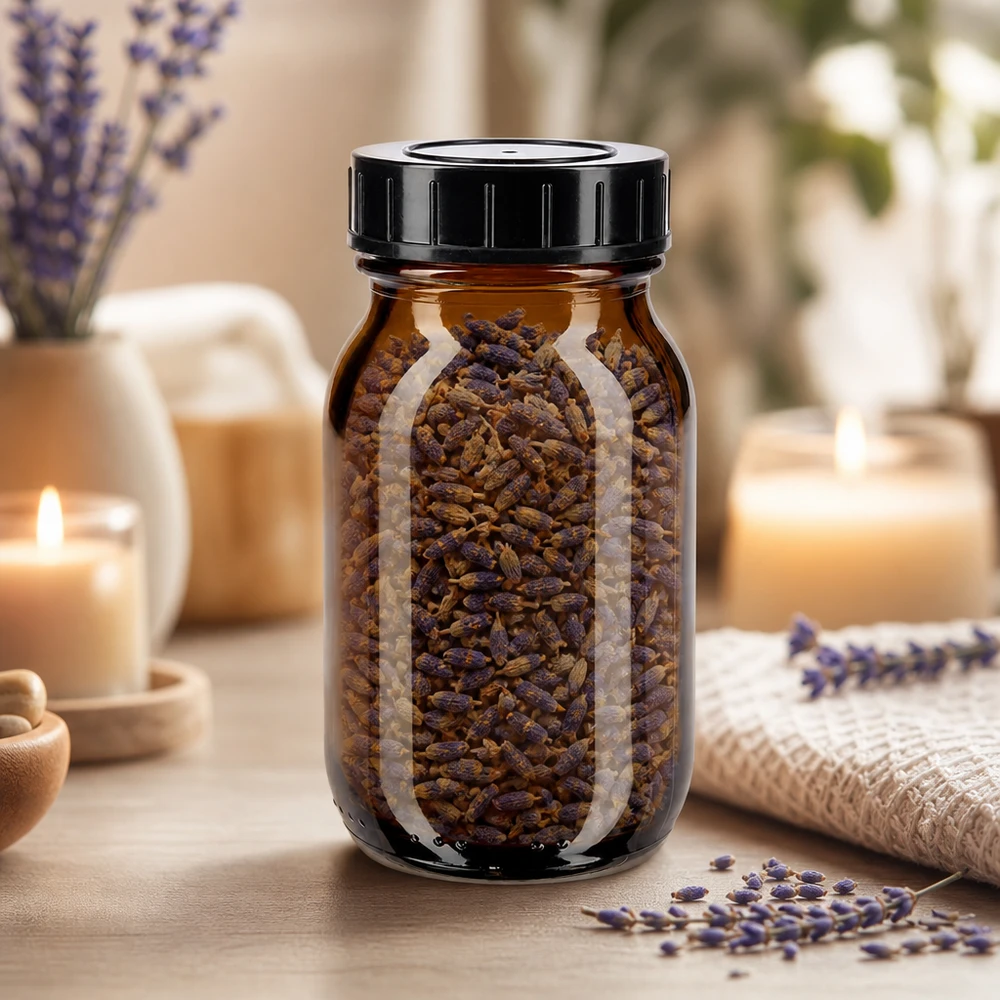 Brede halsfles 100ml in amberkleurig glas met zwarte dop voor aromabewaring