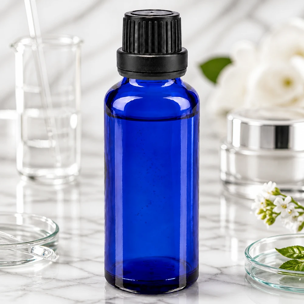 Blauwe glazen flessen 30ml met zwart schroefsluiting dicht. VR Premium Slanke kobaltblauwe glazen fles van 30 ml met fraudebestendige schroefdop van 11 mm