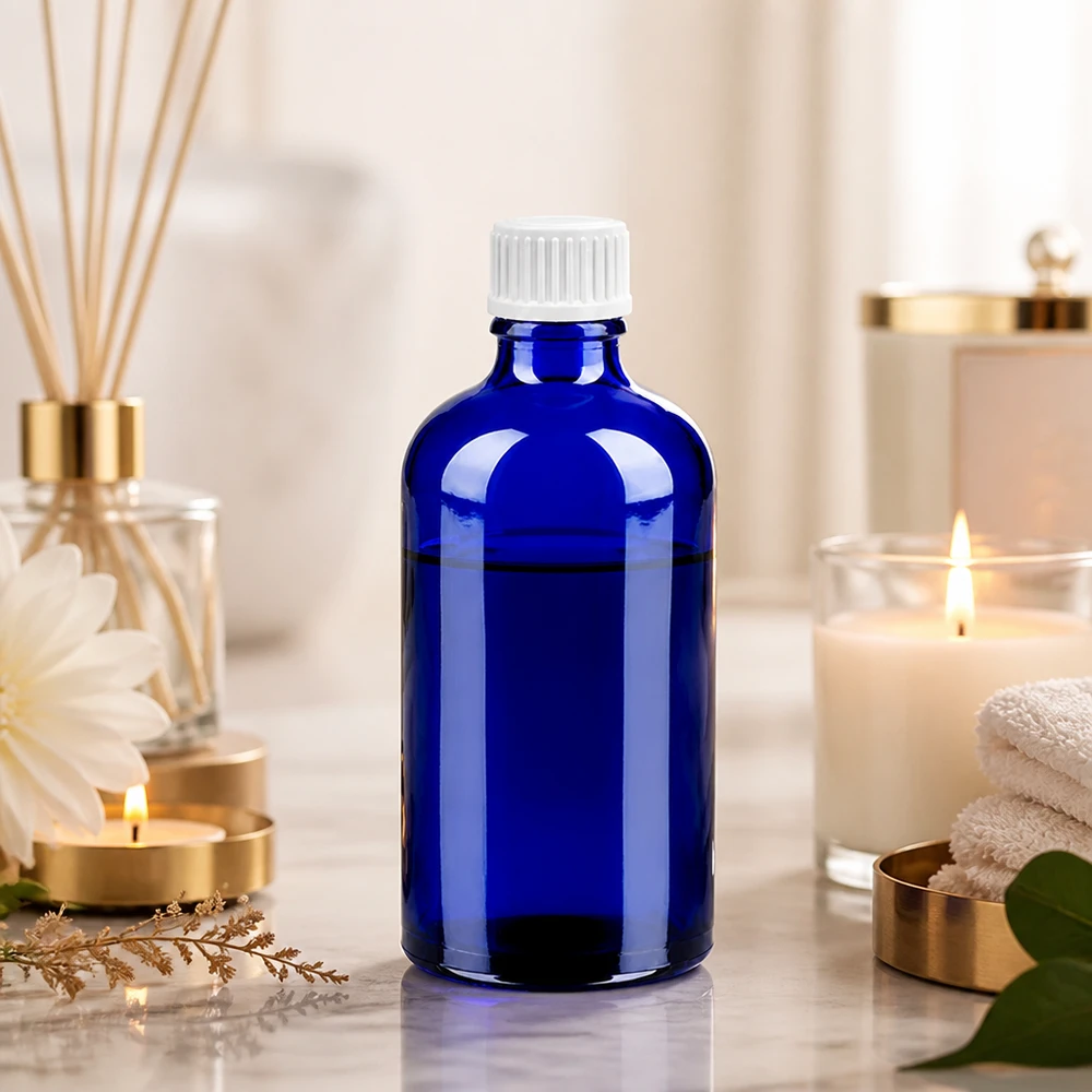 Milieuvriendelijke druppelfles 100ml van recyclebaar blauw glas met duurzame dop