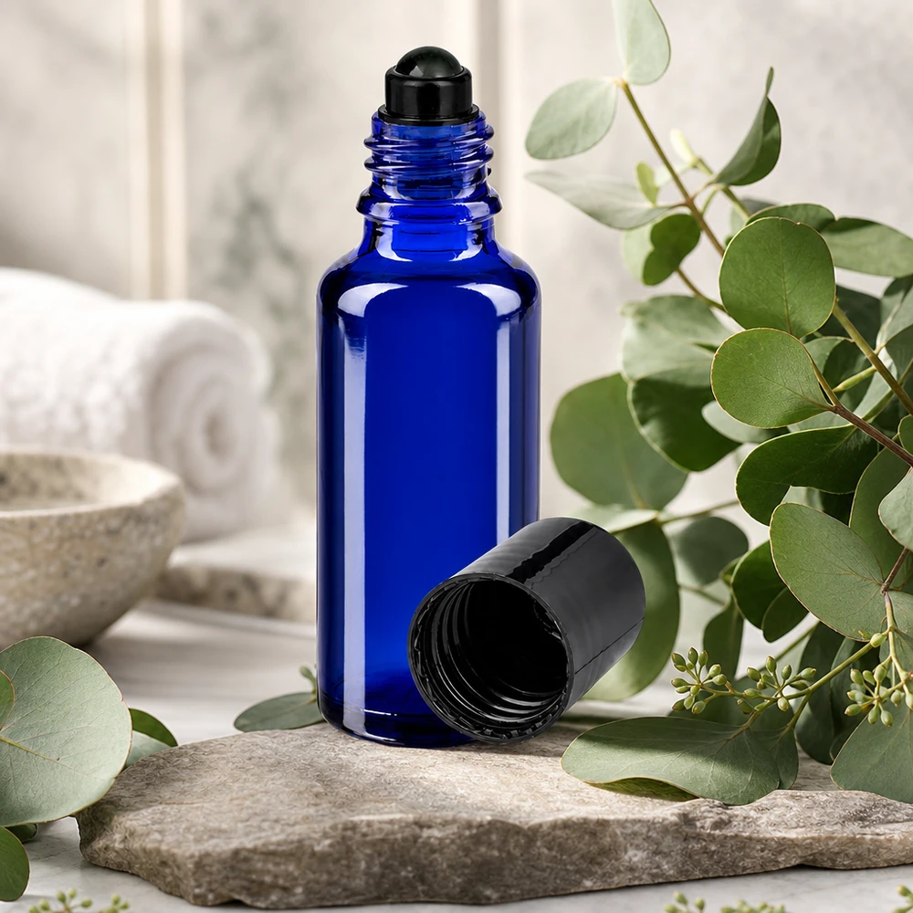 Lichtbestendig apothekersglas 30 ml, blauw, met zwarte rolluikdop voor aromatherapie-oliën