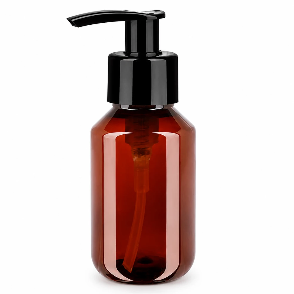 Bouteille PET 100ml avec pompe distributrice noire Compacte, amberkleurige PET-fles van 100 ml met zwarte pomp voor in de badkamer