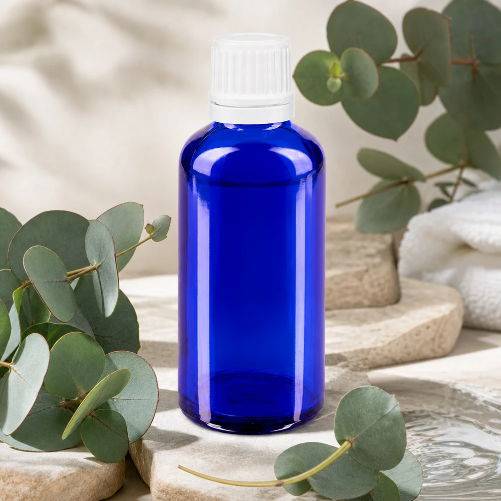 Klein blauw medicijnflesje van borosilicaatglas, 50 ml, met witte doseerdop, OV