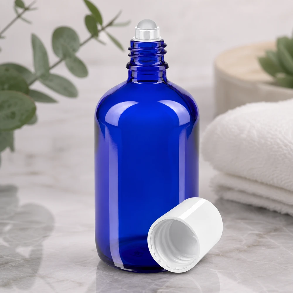 Apothekersflesje blauw 100ml roll-on cap wit Blauwe glazen fles van 100 ml met roll-on, ideaal voor serum, huidverzorging en aromatherapie
