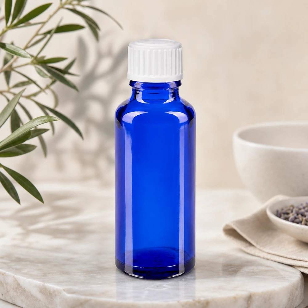 Hoogwaardige blauwe medicijnfles van 30 ml met witte veiligheidsdop, gemaakt van apothekersglas