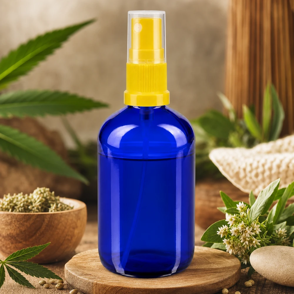 Lichtbeschermende fles van blauw apothekersglas, 100 ml, met gele fijne-nevelverstuiver, standaard