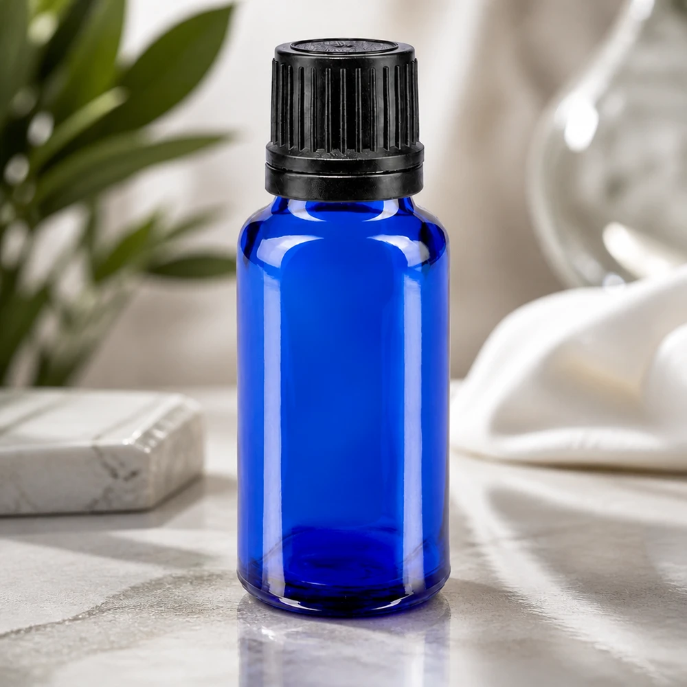 Medicijnflesje van 20 ml van blauw apothekersglas met originaliteitssluiting en doseerinzetstuk