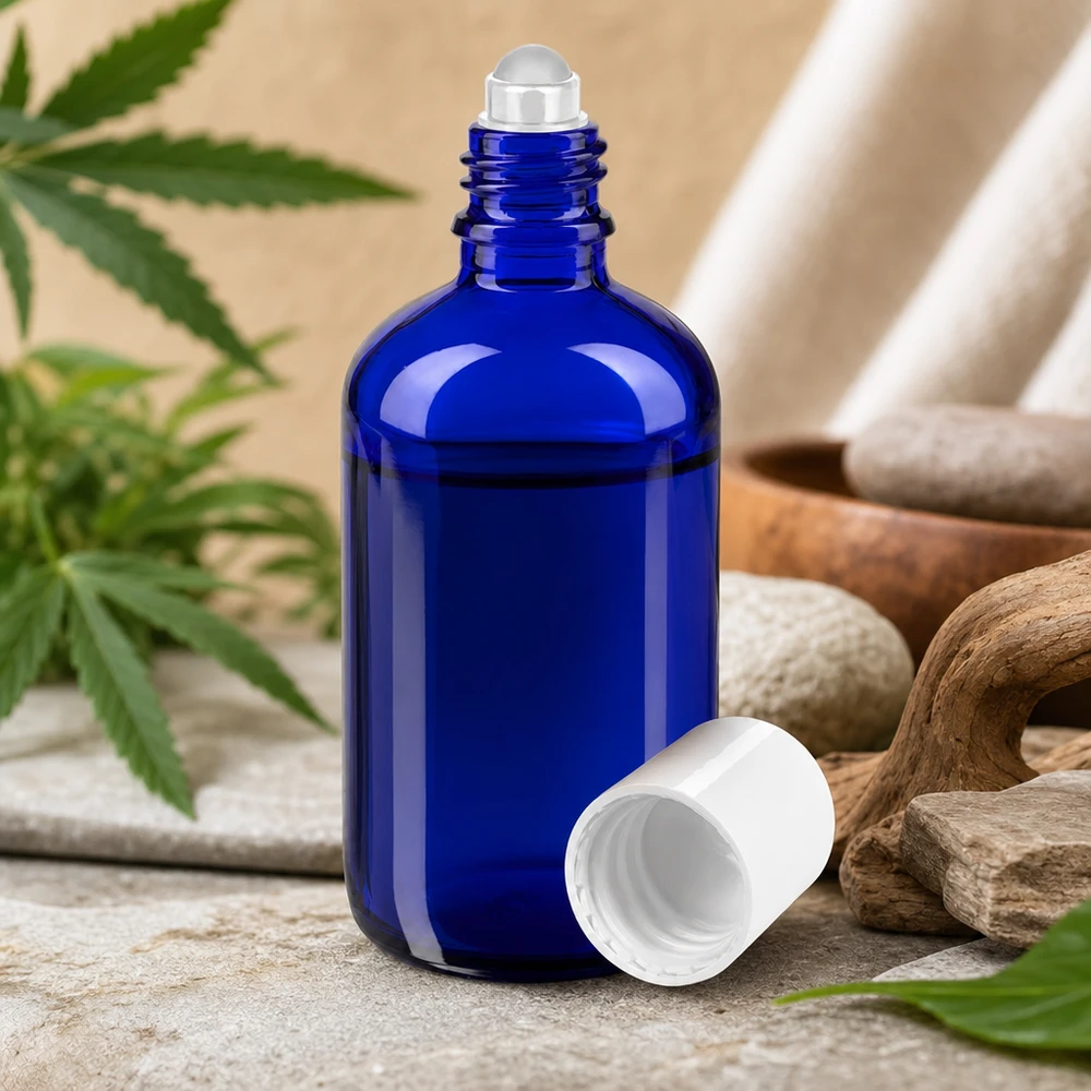 Apothekersflesje blauw 100ml roll-on cap wit Blauwe glazen rollerfles van 100 ml met stalen balletje voor aromatherapie en natuurlijke cosmetica