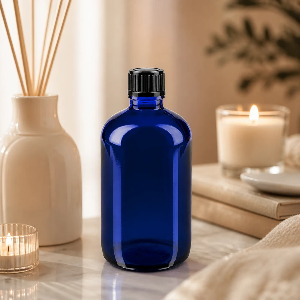 Ronde blauwe glazen fles van 100 ml met kindveilige schroefdop, zwart, 11 mm