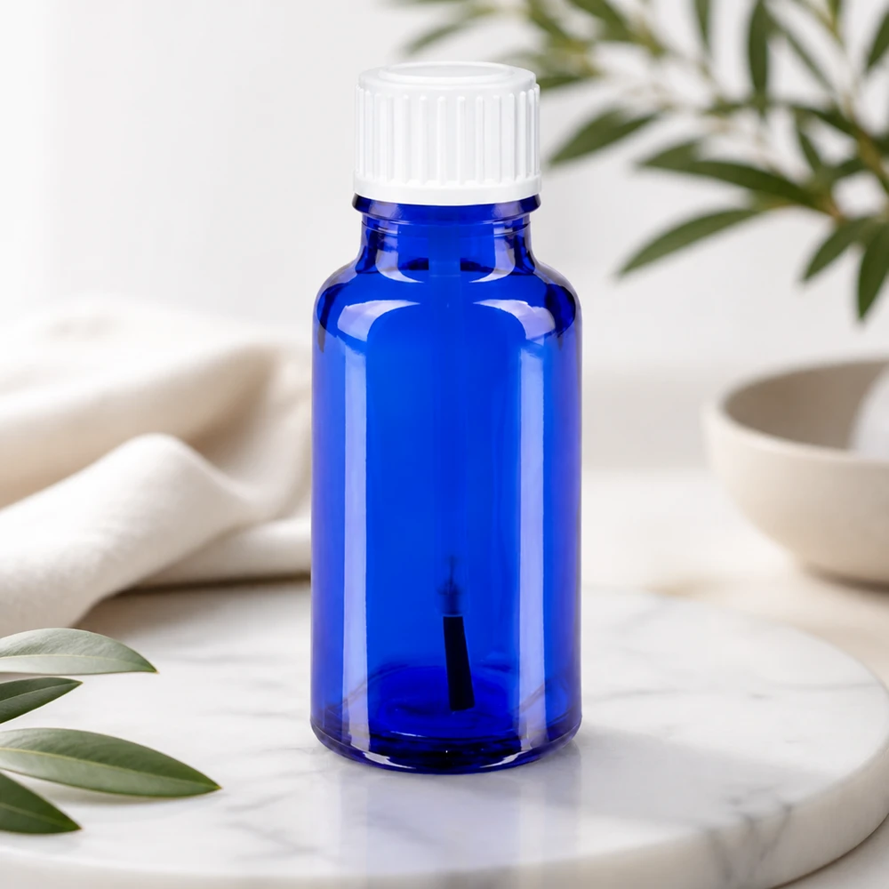 Blauw glazen flesje van 20 ml met kwastje en UV-bescherming voor etherische oliën