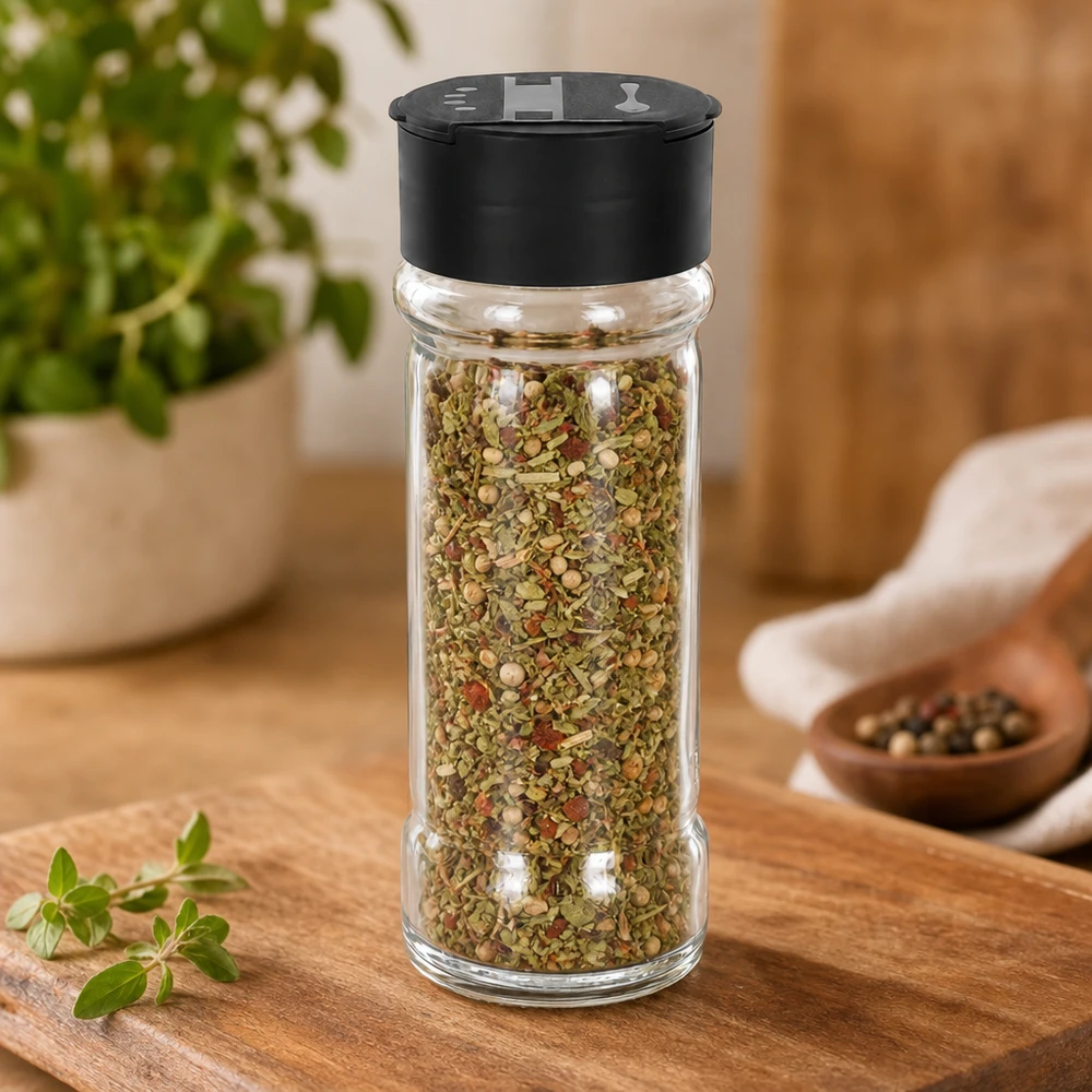 Zout-/kruidenpotje 100 ml met dubbele strooier, zwart Cilindrische strooibus van helder glas, 100 ml, met een bonte kruidenmix en een zwarte dubbele deksel