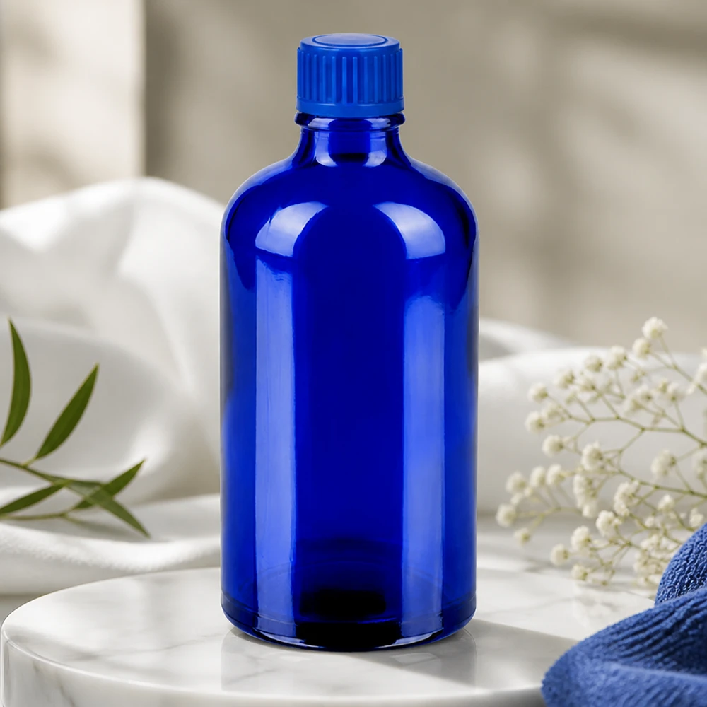 Handige glazen fles van 100 ml in intens blauw met praktische schroefdraad