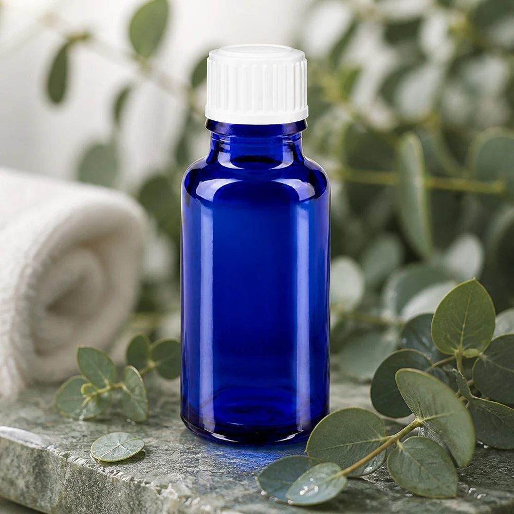 Blauwe glazen medicijnfles van 20 ml met kindveilige witte dop voor etherische oliën