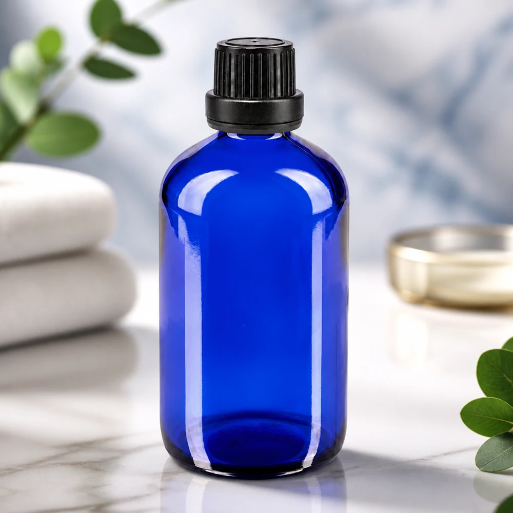 Farmaceutische druppelfles van 100 ml, kobaltblauw, met fraudebestendige schroefdop