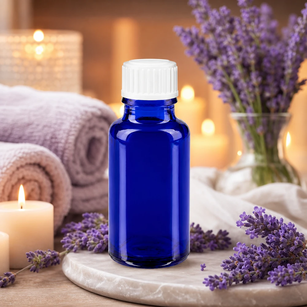 Glazen flesje van 20 ml met blauwe UV-bescherming en een witte schroefdop voor aromatherapie