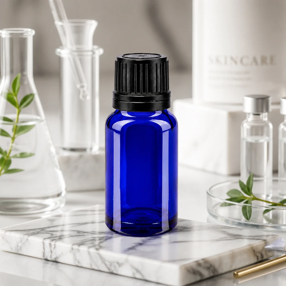 Blauwe glazen flessen 10ml met zwart sluiting OV gietring Hoogwaardig blauw glazen flesje van 10 ml met kindveilige OV-sluiting voor cosmetische formuleringen