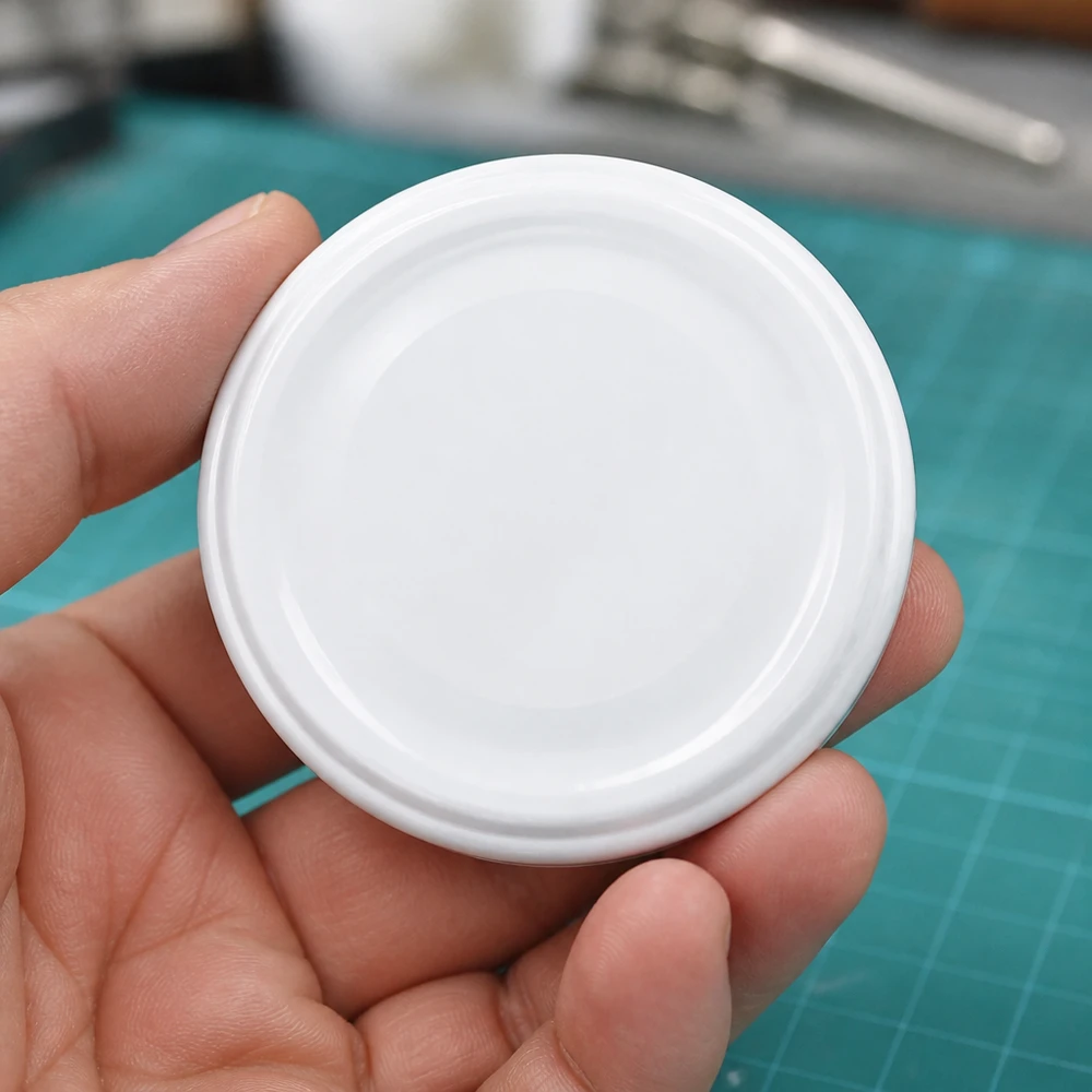 Witte TO43-deksel unitemp BioSeal BPA-NI met concentrische ringen, vingerproef
